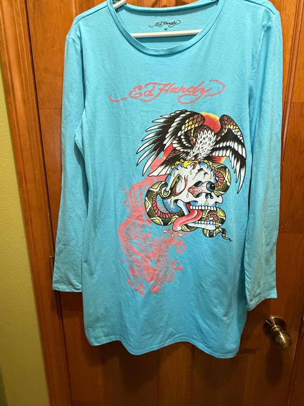 Ed Hardy Y2K Blue Graphics Skull, Eagle, Snake print on the front.